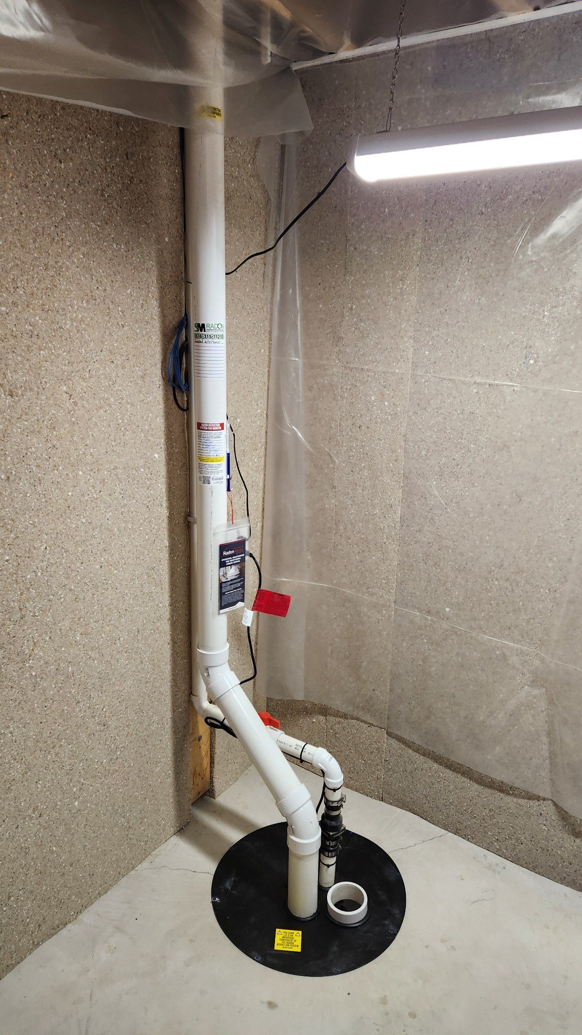 activated-sump-radon-system Activated sump radon mitigation system installed in a sealed sump pit